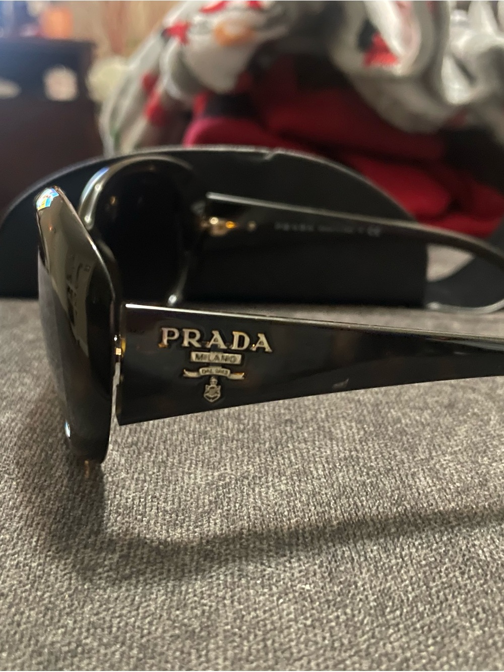 Prada Black Sunglasses with Gold Logo Accents